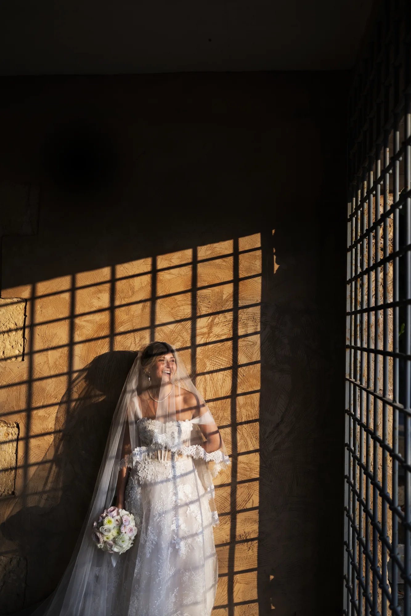 Bride in window light with lattice shadows