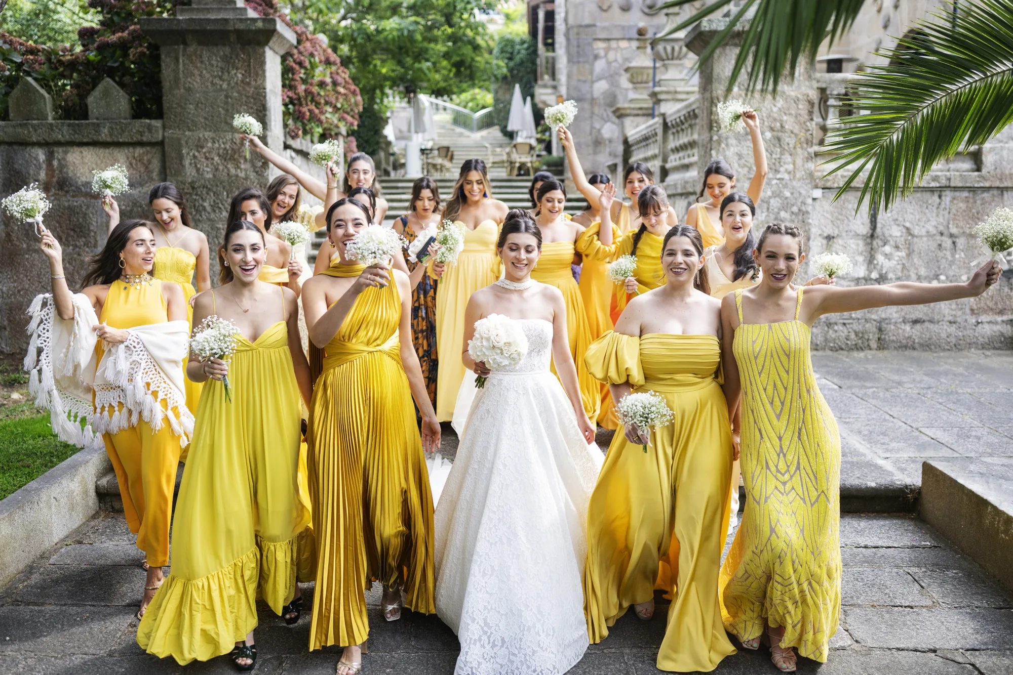 Bridesmaids in yellow cheering around the bride