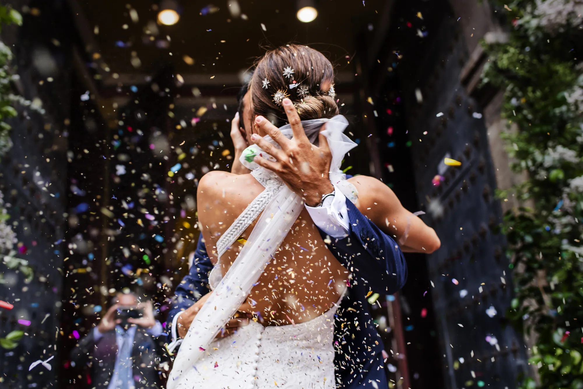 Couple embracing in a shower of confetti